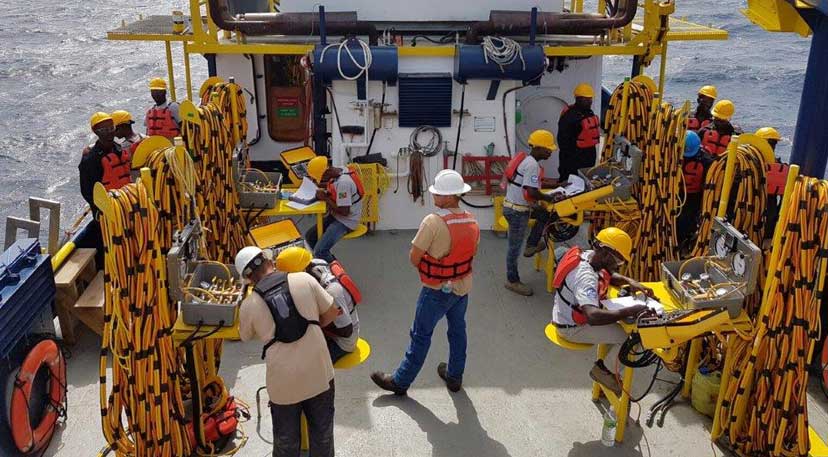 Commercial dive team working from a vessel